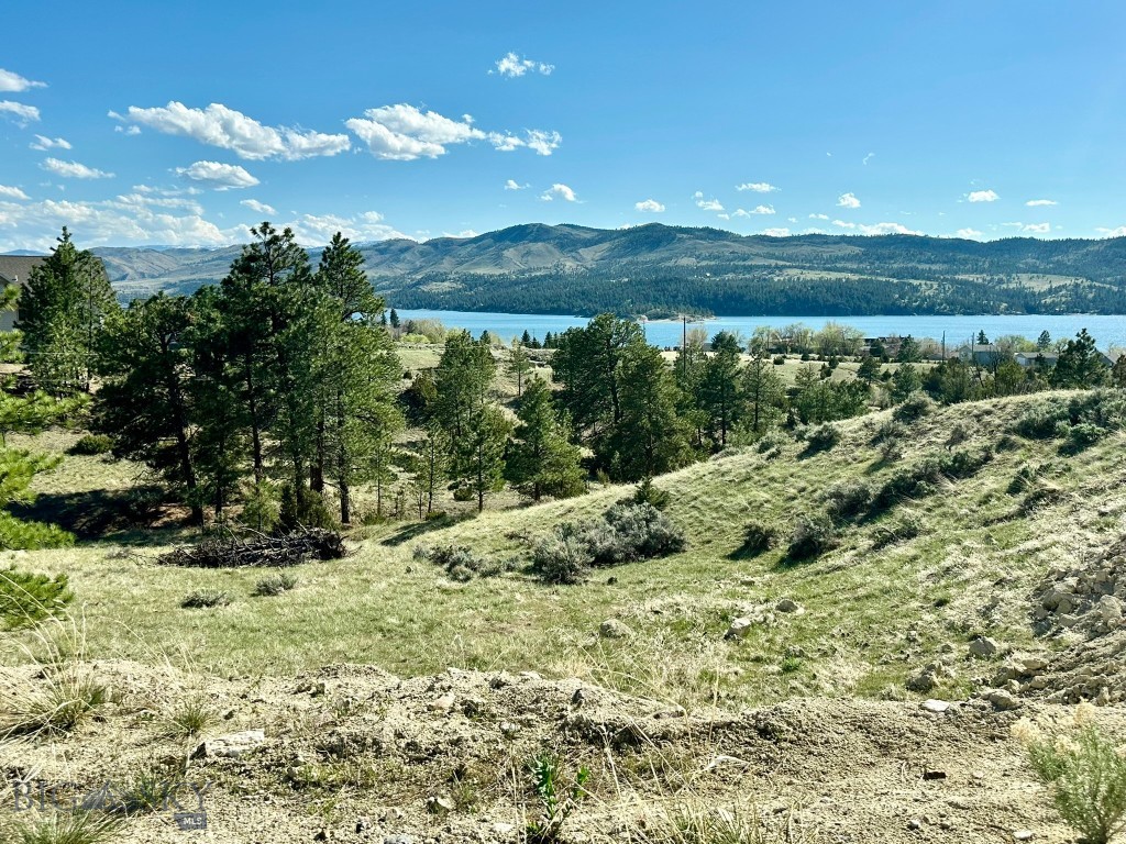 3.6 Acres with Canyon Ferry Lake Views – Investment or Dream Build Opportunity!
Rare chance to own 3.6 acres in Canyon Ferry Crossing with breathtaking views of Canyon Ferry Lake and surrounding mountain ranges. Located adjacent to Bureau of Reclamation land on the west side, this property offers protected land with no risk of development blocking your views.
• 360-degree mountain and lake views.
• Road roughed in + build site started.
• Adjacent to public land for privacy and open access.
• Ideal for your custom home, or long-term investment.
• Flexible land use with space for recreation and entertainment.
Whether you’re looking to build your dream retreat or capitalize on an appreciating market, this property offers location, scale, and vision. Explore the value of lake-view ownership just minutes from outdoor recreation, boating, hunting, and more.