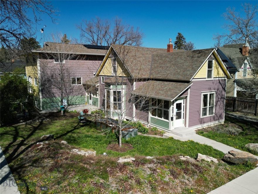 Opportunity knocks - This unique and high performing triplex offers a trifecta of built-in value: a historic footprint, a proven income stream for over 25 years and a coveted location in the heart of historic Bozeman. First time on market in over 25 years! Situated just blocks from Main Street shopping, dining and amenities and minutes to Montana State University, this property is the perfect blend of location and lucrative investment potential. Fully rented and priced to sell at a 5.8% cap rate, the property consists of three intentionally built units. The front unit is a charming Queen Anne style two story home – known as the Susan Kirk Residence. Featuring up to 5 beds: 4 conventional beds plus a walk-through flex/office and two baths. The main floor features spacious living areas, kitchen and bath. The home has been well maintained and includes a side driveway for parking, enclosed front and rear entryways and retains its historic charm with colorful paint and gingerbread elements including scalloped shingles and a variety of exterior siding textures. An attached duplex features Piping Plovers from the Craigshead Institute’s Murals of threatened and Endangered Species Project. The duplex consists of two side by side units, each with 5 bedrooms and 2.5 bathrooms, featuring spacious living and kitchen areas and additional flex space. An expandable rooftop solar array is connected to the north duplex unit and features EV charging. Concrete parking area features parking for 4 vehicles. A 2-car detached garage is currently used by the owners includes space for a shop/storage. There are several communal bike storage areas on the property including a covered pavilion. Yard spaces have been improved with thoughtful native landscaping and raised garden planters for the occupants to enjoy. Mature trees and shrubs allow for privacy and shade in summer. Many possibilities exist to make the property your own (maintain/condex/development). This is a wonderfully convenient southside Bozeman location – only minutes to Montana State University, hospital, shopping, breweries, music venues, grocery stores, restaurants, services and amenities. Only 25 minutes to Bridger Bowl, 30 minutes to blue ribbon fly-fishing and river recreation, and 1 hour to Big Sky.  Please don’t disturb the tenants – shown by advanced appointment only.  Don’t miss the VR Matterport Tour.