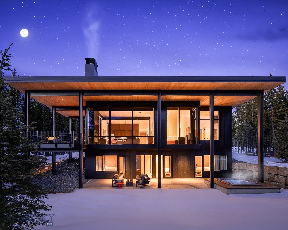 Nestled in the pristine wilderness of Montana, this One&Only Moonlight Basin Private Home offers an unparalleled blend of modern luxury and natural beauty. Thoughtfully designed to complement its breathtaking surroundings, this 3,670-square-foot, five-bedroom retreat seamlessly integrates contemporary elegance with the rugged landscape of towering forests and majestic peaks.
Expansive floor-to-ceiling windows frame panoramic views, filling the home with natural light, while roaring fireplaces and timeless finishes create an inviting atmosphere of warmth and sophistication. Designed for both grand entertaining and intimate moments, the home features spacious indoor and outdoor living areas, ideal for gathering with family and friends.
Enveloped by Big Sky’s snow-capped mountains and lush evergreen forests, this exceptional slopeside residence offers effortless access to world-class skiing, hiking, and outdoor adventure. Whether unwinding in the serenity of nature or embracing the thrill of the slopes, this home is a true sanctuary of luxury and adventure in one of Montana’s most coveted destinations.