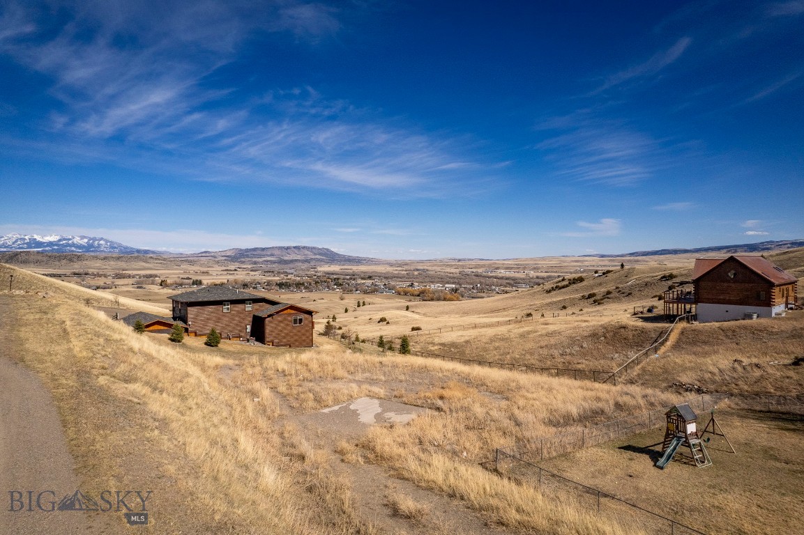 VIEWS VIEWS VIEWS! This spectacular build site offers everything you've hoped to find.....expansive and uninterrupted views sure to mesmerize. It's perfect for a house plan with a walk-out basement and deck off the first floor looking out over town and up to the mountains. Start designing your dream home and picture yourself relaxing while you enjoy the therapeutic views. It's a large parcel just shy of a half acre giving you ample elbow room and a spacious yard, too.