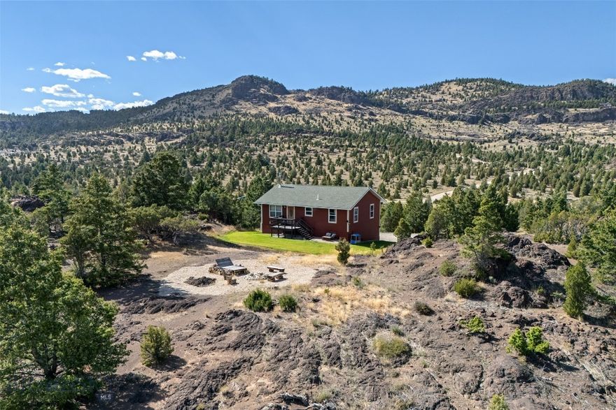This 3-bedroom, 2-bath home sits on 20 acres of Montana paradise, boasting breathtaking mountain views, striking red rock formations, and abundant wildlife. Perfect for those who crave privacy and the beauty of the great outdoors.  Located in Ramsay Montana you are close to both the conveniences of Butte amenities, fun activities at Fairmont Resort, and the Anaconda Georgetown areas!
