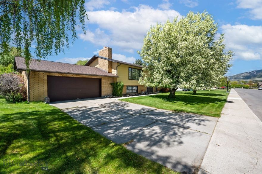 This well-maintained, one-owner home offers the perfect blend of space, comfort, and location on a rare double lot in the desirable West End. With 5 bedrooms and 3 bathrooms, there's plenty of room for family, guests, or a home office.  Enjoy the spacious living room and large family recreation room—each with its own fireplace—ideal for cozy nights or entertaining. The open kitchen and dining area lead out to a large deck surrounded by mature trees, providing a peaceful and private setting.  A dedicated hot tub room, patio area, and generous outdoor space make this home perfect for year-round enjoyment. Car lovers and hobbyists will appreciate both the attached and detached double garages, plus ample off-street parking.  This is a rare opportunity to own a spacious, lovingly cared-for home in a great location. Schedule your showing today!