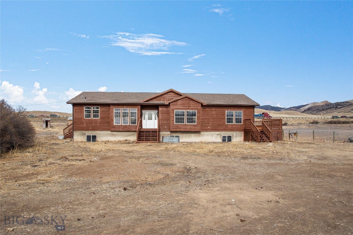 Located on 6.02 acres just outside Whitehall, this property offers the perfect balance of serene mountain scenery and proximity to town amenities. Surrounded by the natural beauty of the Tobacco Root Mountains, this home is ideal for those seeking peaceful surroundings with easy access to a variety of outdoor activities. The home features 5 bedrooms, 3 bathrooms, and a main-level laundry room, providing ample space for comfortable living. Inside, you'll find fresh new flooring and paint throughout, a cozy gas fireplace in the spacious living room, and a fully remodeled kitchen with brand-new appliances and a southern-facing window that offers beautiful views. The partially finished basement includes a family room, a full bath, and two large bedrooms, offering additional living space. The expansive 6-acre lot includes a shed, an oversized two-car garage, and plenty of room for gardening, farming, or outdoor recreation. Additional features include a private well, septic system, professionally cleaned air ducts and professionally cleaned, and walkout decks on all sides to enjoy the surrounding views. The bathrooms have been updated with new tile and modern lighting, and all rooms in the home are generously sized. This property is move-in ready and offers ample space for animals, outdoor hobbies, and relaxation—don’t miss this opportunity to own a stunning home in a beautiful location.