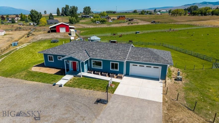 Welcome to this beautiful custom-built 2017 home offering 3 bedrooms, 2.5 bathrooms, and a versatile 4th bedroom or office—set on 5 acres surrounded by the breathtaking mountains and foothills of the Bitterroot Valley. Inside, you'll find an open-concept layout with maple hardwood floors & a chef's kitchen featuring a Thermador gas stove with stock pot faucet, double ovens,  two pantries, & mountain views. The spacious primary suite boasts a walk-through closet, dual vanities, heated floors, & a walk-in shower with dual shower heads and on demand hot water. Step outside to enjoy a private in-ground pool designed with the easy upkeep of an above-ground system, a one-of-a-kind Montana grain silo covered patio, outdoor fire pit, and play structure.  A powered 30' x 35' barn with stalls and a 14' lean-to offers space for your horses, cows, chickens, RV, or equipment. Whether you're starting a hobby farm or just need room to roam, these 5 acres are ready for your vision. Come explore the possibilities and start living your Montana country dream today.
