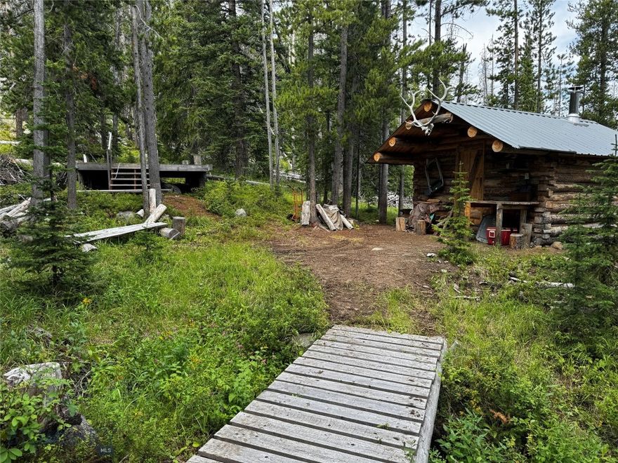 Outdoor Enthusiasts won't want to miss this one! 20.66 acres surrounded by National Forest. Enjoy a private hunting cabin with a wood stove, generator, and 2 tree stands. A year-round creek runs through the property, and the area is known for its ample wildlife - elk, deer, bear, moose, etc. The seller is including a 20' x 12' guide tent for which he has built a platform deck. This property is off grid and currently accessible by ATV or foot traffic. Grab it before the season starts!
