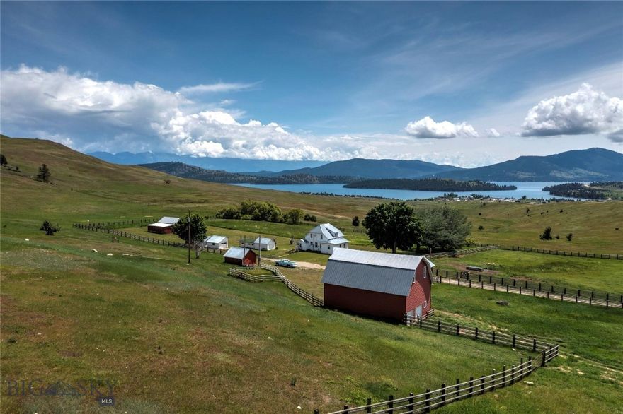 Flathead Lake Overlook is a one-of-a-kind 1,367+/- acre ranch property in Dayton, MT that features the original 1912 farmhouse overlooking Cromwell Island on the west side of Flathead Lake. Owned by the Huckins family for decades, the "Huckins Ranch" as it is locally known, has views of the Mission Mountains that provide a scenic backdrop for the modestly updated 1765sf, 4 bedroom and 1 bath ranch home. The property also has a historic barn and multiple outbuildings including a granary that was modified to host 1055 sf, 2 bedrooms and 1 bathroom guest/managers home. The Montana Land Reliance conservation easement allows the next owner to update or replace the existing homes in their current locations. The rich history of Flathead Lake Overlook and its proximity to Flathead Lake are just the tip of the iceberg with this property. The south-facing slopes, end of the road privacy, and the half-timbered, half grass pasture provide ample space for your next cattle or horse operation or a significant family retreat. The ranch has 5 fenced, well-watered pastures. Naturally formed Bow Lake, a 25+/- acre pond and wetlands area up in the timbered portion of the ranch provides a unique alpine water source for multiple species of waterfowl and other birds as well as elk and deer. To the north, the ranch borders thousands of acres of privately timberland creating excellent elk and deer habitat. Just a mile way in Dayton there is a boat launch and storage facility to enjoy all the recreational pursuits of Flathead Lake. Additional recreation is nearby as Lake Mary Ronan is just a few minutes up the road. Less than one hour to commercial air service in Kalispell and 1.5 hours from Missoula. The quaint town of Lakeside provides dining and recreational opportunities less than 15 minutes from the ranch.