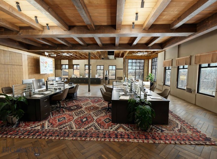 Is your business ready for a refined professional space? Discover Manhattan Town Center #202, a gray-shell commercial condo where you can design the ideal environment for your team and clients. Located in Manhattan’s Central Business District, this space is zoned for a wide range of commercial uses. As a corner unit, it offers a versatile open footprint—perfect for building multiple private offices, collaborative work areas, or a tailored blend of both. One standout feature is the striking “corner room,” which showcases great views and a cathedral-height ceiling, making it an exceptional setting for a conference room or executive office. Ideal for professional users seeking a sophisticated, high-quality location, this condo offers an elevated presence in the growing Manhattan landscape. Designed by Bechtel-Slade Architecture and built by Langlas Construction, the Manhattan Town Center complex includes three distinctive buildings with elevator access and a courtyard for owners and clients to enjoy. Create a space that truly reflects your business right in the heart of Manhattan, MT.