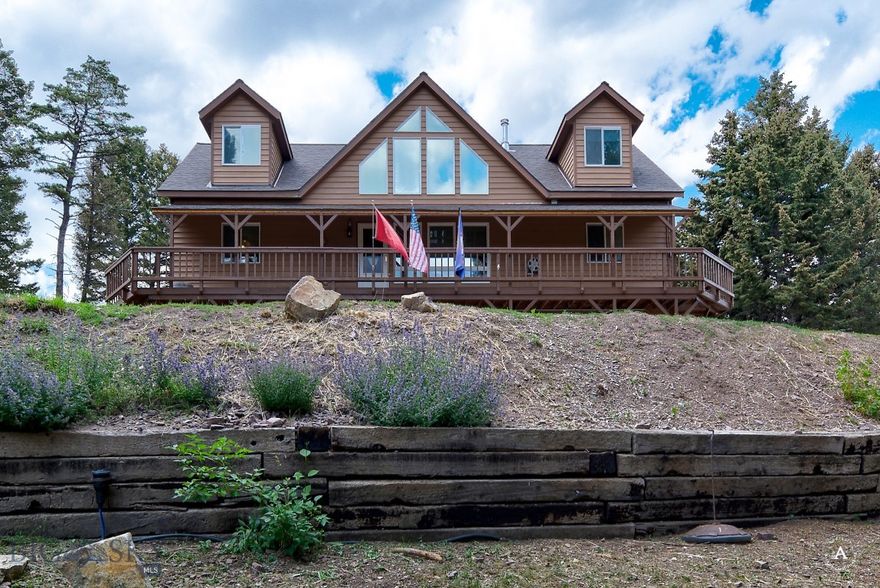 SELLER PAID $10,000 CONCESSION OFFERED! Welcome home to this Magnificent Mountain Estate. A perfectly curated property offering privacy, function, and comfort. Approximately 22 acres cross fenced for multiple pastures; 30x46 foot heated shop with kitchen and bathroom/shower unit for guests; a heated barn housing chickens and ready for hay; and a beautiful greenhouse with ceiling drip system to grow all year long. The covered wrap around deck serves you well in all seasons. Sellers have made several updates to the residence including a new 50 yr shingle roof, interior flooring, new appliances, solid wood doors, interior paint throughout, wood stove, back up residential generator and an impressive 3 bay dog kennel system. Featuring a dumb waiter to do all the heavy lifting from the bottom to the top floors. The residence includes multiple heat sources including a geothermal system which also runs the air conditioning, back up propane heating system, and wood stove. Natural springs pop up on the property feeding the water feature and beautiful Quaking Aspen trees in the front yard.