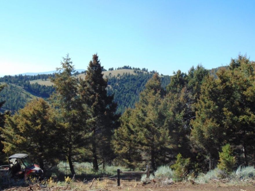 Highly desirable 2.55 acres for sale located near Boulder, Montana, that borders thousands and thousands of acres of public land. There is more public land accessible from this property than you could cover in a lifetime. Property is completely fenced. Sellers have started leveling a cabin/camper site and a loop driveway. Whether you enjoy hunting, hiking, fishing, camping, or just spending quality time with your family in the Montana Mountains, this listing can offer that to you. The property is situated near Comet, which is conveniently located near Boulder, Helena, and Butte, Montana. Comet is a ghost town and is rich in Montana history. If you are looking for a private, peaceful mountain scene, you should come take a look. The town is named after the Comet Mine, which was one of the richest mines in this district. Some of the ores produced included lead, zinc, copper, silver, and gold! But, don’t forget about all of the recreational adventures that surround this property. If you enjoy fly fishing on a mountain stream, take your 4-wheeler to the Boulder River and go fishing; it’s just a few miles away. And it’s a short drive to Prickly Pear Creek, the Missouri River, Lake Helena, Helena National Forest, the Elkhorns, or even Tizer Botanic Gardens. This is the perfect property to build your mountain getaway! Are you looking for a slower, more enjoyable pace of life? Imagine waking up to a hot cup of coffee and sitting on your front porch in the fresh, cool mountain air overlooking the beautiful mountain views from your very own cabin in the woods. Then, picture your family and friends gathered at your mountain retreat to enjoy days of county fairs, rodeos, and outdoor activities such as hunting, hiking, horseback riding, fishing, boating, and swimming, and nights of storytelling, marshmallow roasting, and relaxing around your campfire ring. It’s not a dream; this is how many live here in the friendly western state of Montana. This is a rare opportunity and is sure to go quickly.