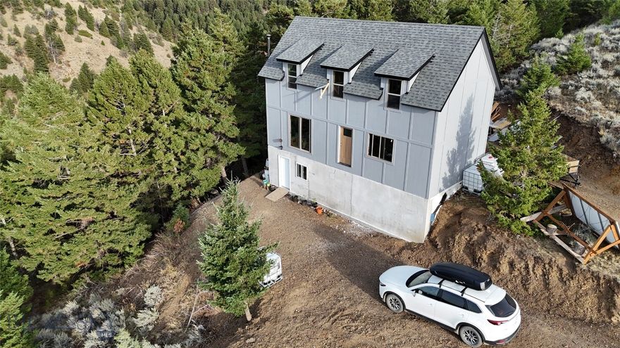 Here is a great chance to make this home your own. A nearly finished 3 bed 3 bath home on almost 10 acres, surrounded by evergreens on one side and incredible views on the other. This architect's home has a well thought out floorplan and could be a great place for homesteading. The Ponderosa Pines neighborhood has easy access to everything Montana has to offer, including the Missouri River and public land. Get into this home before winter and enjoy the warmth of the wood stove while planning your next adventure.