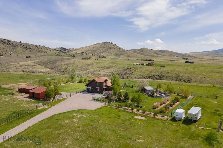 Fabulous, rural living on this 20-acre horse property in McAllister, MT, just north of Ennis. With 360-degree views, sitting at the base of the Tobacco Root Mountains to the west, Centennial Mountains to the south, and the Madison Range to the east, you will find yourself living in a literal paradise. The property is fenced and cross fenced with good grass pastures that will support your horses or other animals all season long. Get your hay, fresh cow and goat milk, and farm raised eggs from your neighbors or raise them right here on your property. Continuous flow stock water tank horse trough to provide year-round drinking water. Power in the barn/shop with lights and outlets. Barns feature metal roofing, hay storage area, and area for animals to eat out of the weather. A second loafing shed with feeders is located nearby for more animals to have shelter. Pastures and rest of the property have been diligently maintained and kept weed free. Additionally, you will find this property to be a gardener's paradise with drip lines installed on all trees and shrubs. This fantastic garden property has 100+ aspen and rocky mountain juniper trees, honey suckle, lilac, other flowering shrubs, blue wisteria, clematis, roses, fruit producing grape vines, hollyhock, sunflowers, wildflower beds, small fruit tree orchard, gazebo, green house, and so much more. The beautifully maintained, two-story home is a perfect fit for this rural retreat. Instant hot water at the kitchen sink, indoor barn doors, hand sawed wood floors, fiber optic lines, F Bertazzonia Italia propane stovetop, 500-gallon propane tank, propane fireplace, pellet stove, foam board insulated septic lines, remodeled bathroom, granite countertops, backup generator, and freshly stained exterior, maximize the comfort level of your rural living experience.