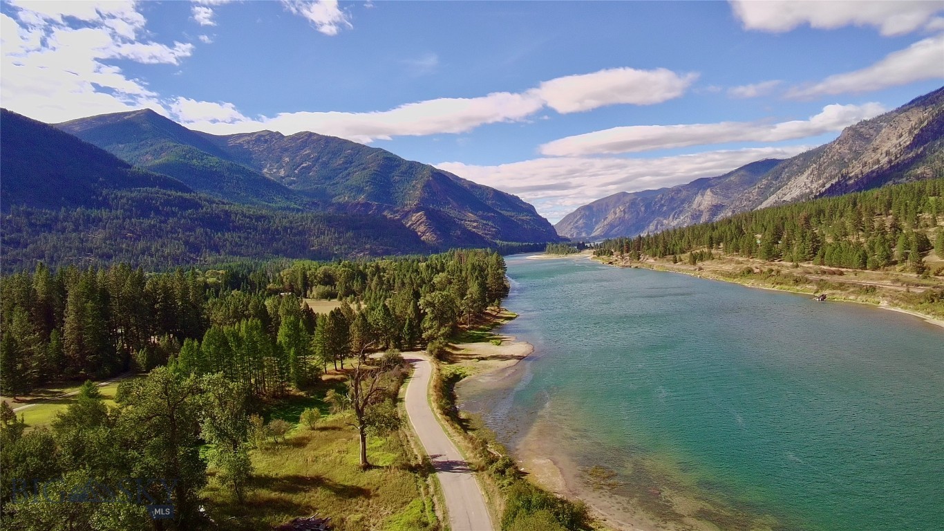White, soft sands line the banks of the renowned Clark Fork River on this tranquil 22.51-acre property! Located fifteen miles from Plains, Montana, the parcel is partially wooded, providing a natural habitat for roaming elk, deer, and turkey. With available utilities, this is the perfect opportunity to realize your vision for a rural, mountain residence with gorgeous river views, where you can enjoy evening strolls to the river’s edge for fishing or embark on a sunset boat ride. The windows of your future home can frame the breathtaking views of the Cabinet and Coeur d'Alene mountain ranges. Whether you choose to camp for a tranquil getaway or construct a charming log cabin, Western Montana offers abundant recreational activities, including hunting, fishing, camping, boating, hiking, wildlife viewing, and exploration.
