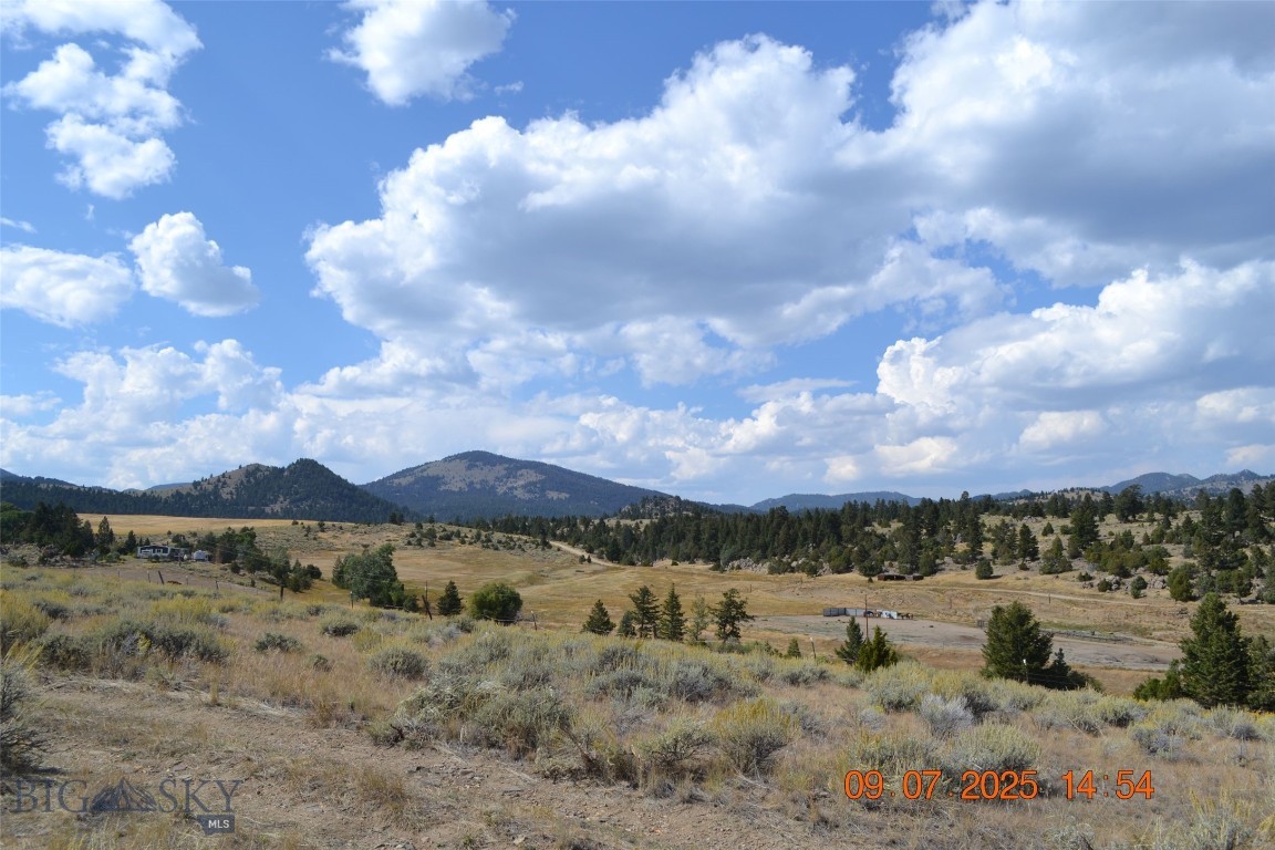 A little over 21 acres with county road access. Many level building sites with 360 views of Tobacco Root, Highlands and Bull Mountains. Power to the property. Varying ground from flat sagebrush to tree covered slopes. A rough cabin is on the property and can be used with a lot of TLC. 14 miles to I-90 access and Butte and only 15 miles to Whitehall, close to town but country living. Good phone coverage in area (verizon).