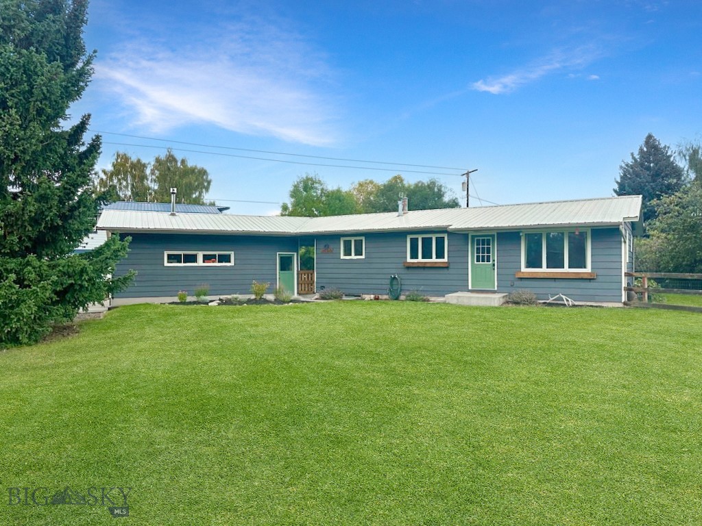Beautifully updated ranch-style home in the highly sought-after Hillcrest School District, just minutes from the Butte Country Club. This 4-bedroom, 2-bathroom residence blends timeless charm with modern upgrades. Step inside to discover an open floor plan featuring gleaming hardwood floors, a newly remodeled kitchen with custom tile, stainless steel appliances including a gas range, butcher block countertops, and a spacious living room perfect for gathering. The main level offers two generously sized bedrooms and a full bathroom with a custom-tiled walk-in shower. The fully finished basement expands your living space with two additional bedrooms, a large family room, a full bathroom with a claw-foot tub, abundant storage, and a convenient laundry area. Outside, enjoy the oversized detached two-car garage equipped with a wood-burning stove, underground sprinkling, raised garden beds, and a covered patio ideal for entertaining year-round. The expansive yard provides both space and privacy. This home truly has it all—style, functionality, and location!