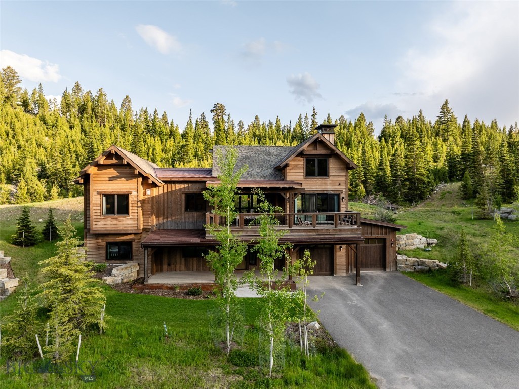Discover this exceptional mountain home nestled in Highlands, the heart of Spanish Peaks Mountain Club. This fully furnished as seen in photography, 5-bedroom, 5-bathroom home offers an ideal balance of classic alpine design and modern sophistication, creating the perfect retreat for family and friends. Featuring open living spaces, vaulted ceilings, and expansive windows that invite natural light and showcase breathtaking views of the surrounding old-growth pines and the majestic mountains beyond. The home boasts a spacious and chef-inspired kitchen with high-end appliances, sleek cabinetry, and a large island perfect for gatherings. Enjoy cozy moments by the fireplaces, including one in the luxurious primary suite, or step out onto your private patio to unwind in the hot tub while enjoying surround sound in the background. With its rustic yet modern touches, including rich timber beams and natural stone accents, this home offers an elegant yet comfortable atmosphere throughout. Situated just
steps from skiing, hiking, golf, and a wealth of outdoor activities, this home is ideally located within walking distance to The Highlands' exclusive skiin/ski-out trails & lift, Montage Big Sky, the Spanish Peaks Mountain Club clubhouse, and the future Aspire lodge. Enjoy unparalleled access to the best of Spanish Peaks Mountain Club's recreational offerings, including alpine and cross-country skiing, mountain biking, snowshoeing, and worldclass golf on the Tom Weiskopf Championship Golf Course and Tom's 10 Par 3 Course. With everything you need at your fingertips, from outdoor adventure to refined relaxation, this fully furnished home is a must-see for those seeking an elevated mountain lifestyle. A Spanish Peaks Mountain Club Social Membership is required with this property.