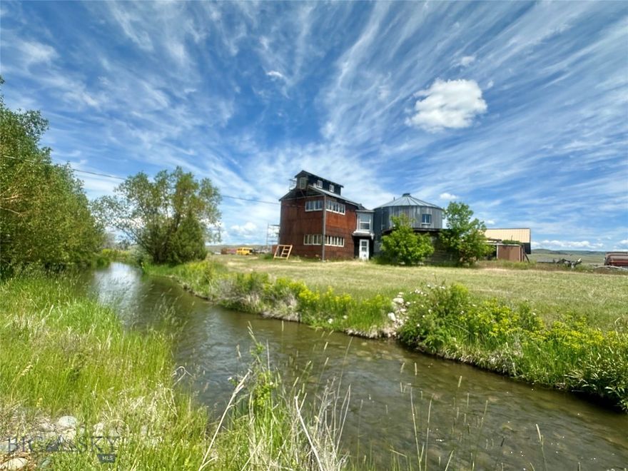 With an address of MADISON RIVER ROAD - you know you are in blue-ribbon fly-fishing country! This 10 property acre is fenced and level, making it a phenomenal HORSE PROPERTY - with miles of dirt road and public lands nearby to ride. Don't forget the opportunity for RENTAL INCOME! With NO COVENANTS this is an ideal location for an Airbnb, add rental cabins, or host recreational glamping! This unique home sits on 10 pristine acres with year-round Hudson Ditch running through the property. Great location near fly-fishing heaven and outdoor recreation. Enjoy relaxing by the water and gazing at the star-filled Montana night sky. This home is ready for you to personalize as your own. GORGEOUS 10 fenced acres with year-round Hutchinson ditch running through the property. There is one existing small dry cabin. The property features Canada Red choke cherry trees, annuals, hops, and a 60gpm well. Lovely land that has not been grazed and is level, useable, and fenced - so bring the horses. Dirt roads and public lands nearby to trail ride on. Deer, elk, pheasant, and Hungarian partridge pass through. Seller is cleaning up the property and will consider offers to sell as-is. Located off Norris Road, between Black Fjord and Grey Cliff Fishing Access. Local attractions include the Norris Hot Springs and Buffalo Jump State Park. Live where others play with Big Sky Resort ~65 miles and Yellowstone National Park ~100 miles. Approximately 20 miles to the Four Corners area of Bozeman.