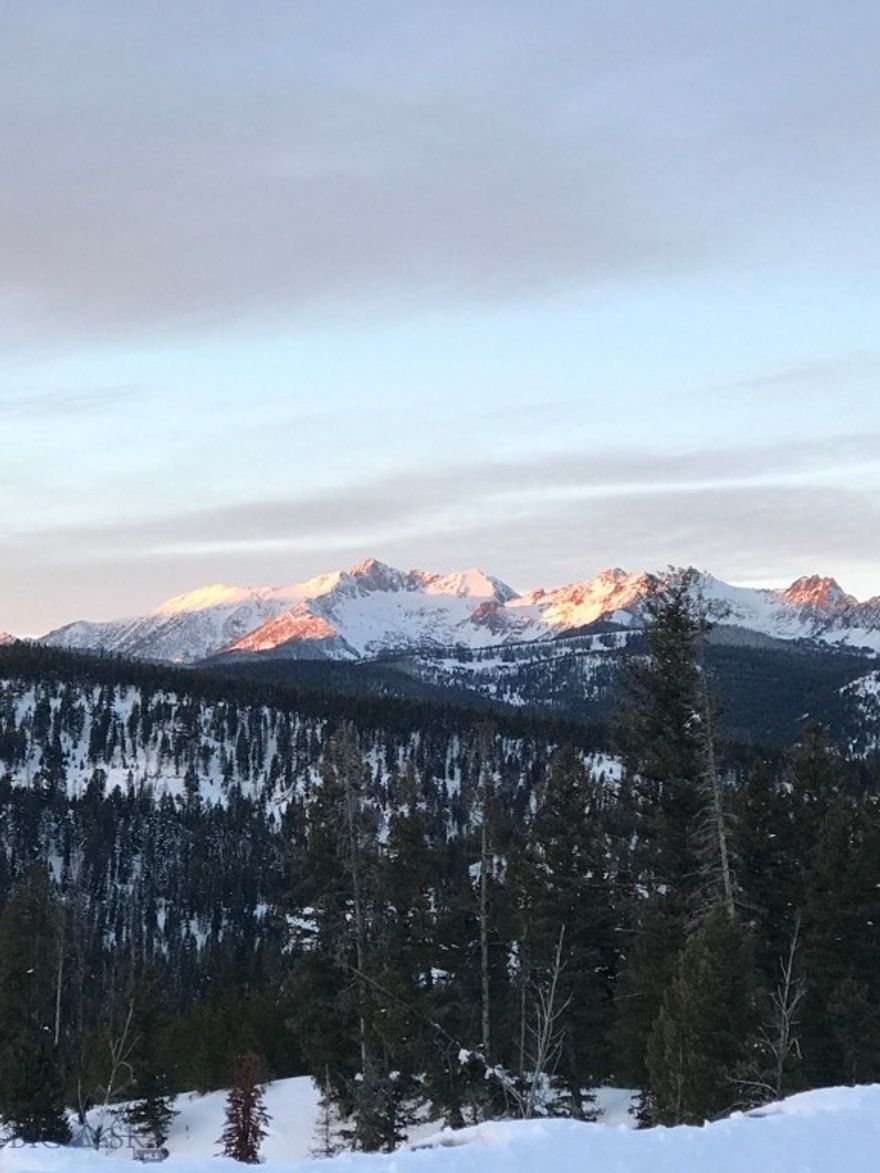 Nestled within the private gates of Spanish Peaks Mountain Club, this exceptional 1.25-acre homesite represents one of the premier build opportunities in Big Sky for 2026. Framed by sweeping views of Spanish Peaks and Lone Mountain, the property’s westerly-sloping terrain captures dramatic sunsets and panoramic mountain vistas, creating an extraordinary setting for a custom legacy residence.

Elevated above the front nine of the championship golf course, the homesite offers both privacy and perspective—mature evergreens provide natural screening while thoughtfully preserving open sightlines across rugged alpine terrain. The topography lends itself beautifully to a walk-out design, expansive outdoor living spaces, and seamless indoor-outdoor mountain architecture.

A Charter Golf Membership is available, unlocking access to Tom Weiskopf’s Signature Golf Course, private ski-in/ski-out amenities, the members’ clubhouse and Montage Big Sky, exclusive dining venues, and a full suite of world-class club experiences. Spanish Peaks continues to stand as one of the most coveted private communities in the Northern Rockies.

Ideally positioned just minutes from Yellowstone Club, Big Sky Resort, and Town Center, the property delivers rare proximity to year-round adventure while maintaining the quiet seclusion that defines true mountain luxury.

Whether you envision a contemporary alpine estate or a timeless mountain lodge, this homesite offers a blank canvas for refined, generational living in the heart of Big Sky.