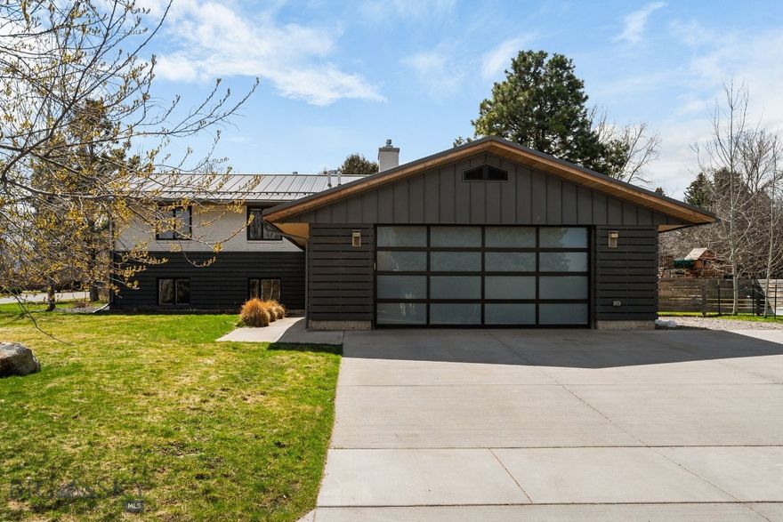 Located in a highly sought-after South Bozeman setting near Montana State University, this fully remodeled home at 2503 Spring Creek Drive seamlessly blends modern luxury with functional living on a spacious half-acre lot. Originally built in 1969 and taken down to the studs, the home has been thoughtfully redesigned with high-end finishes throughout, including premium Viking appliances in a beautifully updated kitchen that opens to a sun-filled, south-facing deck—perfect for entertaining or relaxing. The property backs directly to a quiet neighborhood pocket park, offering a rare combination of privacy and open space, while a private irrigation well keeps the expansive yard lush and green. Inside, you’ll find 5 bedrooms and 3 bathrooms, along with a large basement ideal for a media or game room, radiant floor heat, central A/C, and forced air heating for year-round comfort. Additional features include an EV charger in the garage, a hot tub in the backyard, and a versatile outdoor shed equipped with heat and electricity—currently set up as a private workout studio—making this property a unique opportunity to enjoy both convenience and lifestyle in one of Bozeman’s most desirable locations.