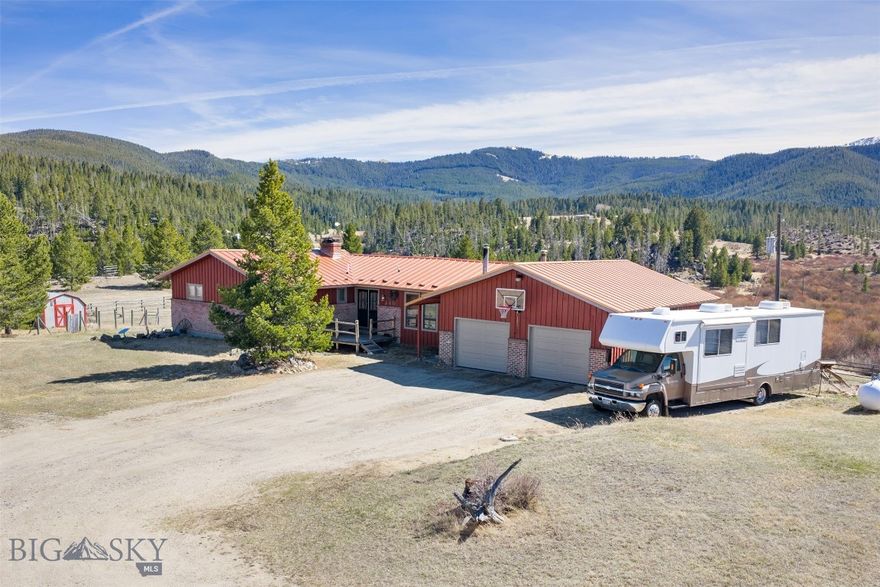 Situated on 8.28 acres of scenic Montana countryside, this exceptional property at 240 Roosevelt Drive offers the perfect blend of space, comfort, and functionality. With breathtaking views of the surrounding mountains and valley, this home is ideal for those seeking privacy, room to roam, and a true Big Sky lifestyle.
The spacious residence features 4 bedrooms and 2 bathrooms, including three bedrooms and a full bath on the main level. An updated kitchen serves as the heart of the home, offering modern touches while maintaining a warm, inviting feel. Step outside onto the expansive wrap-around deck and take in the stunning panoramic views—perfect for relaxing or entertaining. The full daylight basement provides additional living space, complete with a fourth bedroom, second bathroom, and a cozy pellet stove insert and large family room, plus a bonus room that would be a perfect craft room or office. Designed with both convenience and versatility in mind, the property includes an attached double-car garage, a detached single-car garage, and an additional shop/garage—ideal for storage, hobbies, or workspace. The acreage is thoughtfully set up with separate fenced paddocks, making it well-suited for horses or other animals. A backup generator adds peace of mind, ensuring comfort and reliability year-round. Whether you're looking for a hobby farm, a peaceful retreat, or a property with room to grow, this one-of-a-kind offering delivers it all.