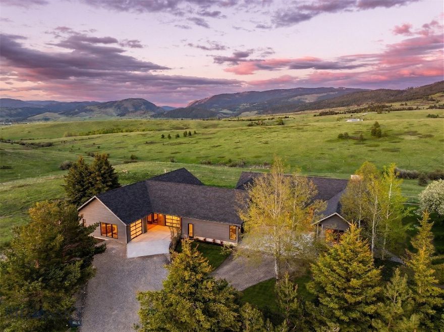 Discover the best of Montana living at 370 Star Ridge Rd, where refined luxury meets the natural world. Located within exclusive Eagle Rock Reserve—just 10 minutes from historic Main Street Bozeman—this renovated and expanded 20-acre estate is a peaceful sanctuary. The recently completed Scandinavian-inspired guest addition makes this property perfectly suited for multi-generational living. Geared to the outdoor enthusiast, the community features private Forest Service access via a private trail network, a fly-fishing pond and premier horse facilities. Sweeping, protected mountain views across conservation lands stretch in every direction. Unique arrangement with HOA means there are only 3 acres surrounding the home to care for – the remaining acreage is in community managed stewardship. Here, daily life is elevated by an intimate connection to nature, complemented by regular sightings of resident elk, moose, deer, and abundant birdlife. Offering 6 total bathrooms and 5.5 total bathrooms, the original home has been updated and re-imagined, highlighted by a recently completed luxury-level addition. The new wing features a great room kitchen-dining and living room, a corner primary suite and additional guest bedroom and bath, large laundry and mud room, an attached heated 2 car oversized garage with pet wash, an attached heated 1-car garage and a finished heated and cooled hobby/office garage – every detail evoking modern comfort. The addition features custom white oak wire brushed cabinetry, vaulted ceiling, panel-front appliances, quartz counters, and custom lighting. The original home has been refreshed with two new Grapa decks featuring custom metal railings, a Hot Springs hot tub, wood flooring throughout the main level, new interior trim and paint, new sliding exterior doors, new HVAC with central A/C. Enjoy multiple living rooms/dens, the added peace of mind of a 24kW Generac natural gas fired, new roof in 2023, and a new 6-bedroom septic in 2024. Conceptual plans are available for future main home kitchen and bath remodels. Landscaping includes custom rock retaining walls, perennial plantings, invisible dog fence, irrigation and formal lawn area. Additional areas have new topsoil and will be hydroseeded in spring. This amazing property is close to downtown Bozeman trails, dining, shopping, amenities and major medical. Just 30 min to Bridger Bowl, 1 hour to Big Sky, 25 minutes to blue ribbon fly fishing. Don’t miss the 360 VR Matterport Tour.