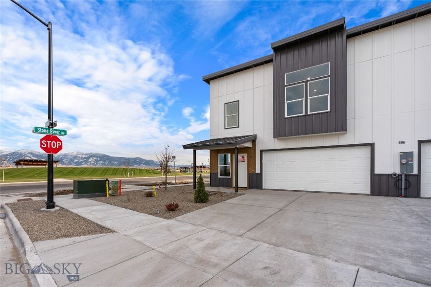 END UNIT THAT BACKS TO PARK WITH PERMANENT VIEWSHED OF MULTIPLE MOUNTAIN RANGES.  FULLY COMPLETED READY TO CLOSE! Spectacular 4 bedroom townhome south of the interstate on the Bozeman “side” of Belgrade. This new master planned community features a lake, beach, playground, trails and dog park AND COMMANDING BRIDGER MOUNTAIN VIEWS! These units have real Alder wood cabinets, quartz waterfall islands, large bedrooms, fenced yards and AIR CONDITIONING INCLUDED! The moment you step inside, you are greeted with the exquisite finishings and sweeping natural light that is characteristic of the entire home. This townhome you own the land and it really lives like a single family home. The open floor plan has a fireplace, large dining room, 4 seating island, closet pantry and MASSIVE cabinet space! Upstairs you have an office loft area, extremely large master suite with volume ceilings, a transom blue sky window and the biggest walk-in master closet you have ever seen! The generous garage is HEATED and comes with a garage door opener. Extremely fast access to the airport (5 minutes), Main Street Belgrade (5 min), Bridger Bowl (32 min), Main Street Bozeman (15 min), Bozeman Hot Springs (12 min), and Big Sky Resort (59 min)! Look no further as this is your opportunity to make your Montana dreams a reality! Nestled within the brand-new West Post master planned community, this luxurious home is minutes away from all the adventure Bozeman has to offer. Invite friends and family to share your Montana lifestyle as you entertain in your chef’s kitchen and enjoy the Bozeman weather. INCLUDED UPGRADES IN PRICE: Solid Surface Luxury Vinyl Plank flooring, Upgraded Wood cabinetry $5,000, Quartz countertops $7,000,Waterfall Quartz Island $3,000, Fireplace $2,500, Steel Fireplace Mantle $800, Refrigerator $1500, Air Conditioning $7,000, Metal standing seam roof $10,000, Slab construction (no crawlspace) $12,000, Fenced Yard $15,000, Exterior metal siding 3’ above grade $7,000, Sod in backyard $3,000, Sprinkler system $4,000