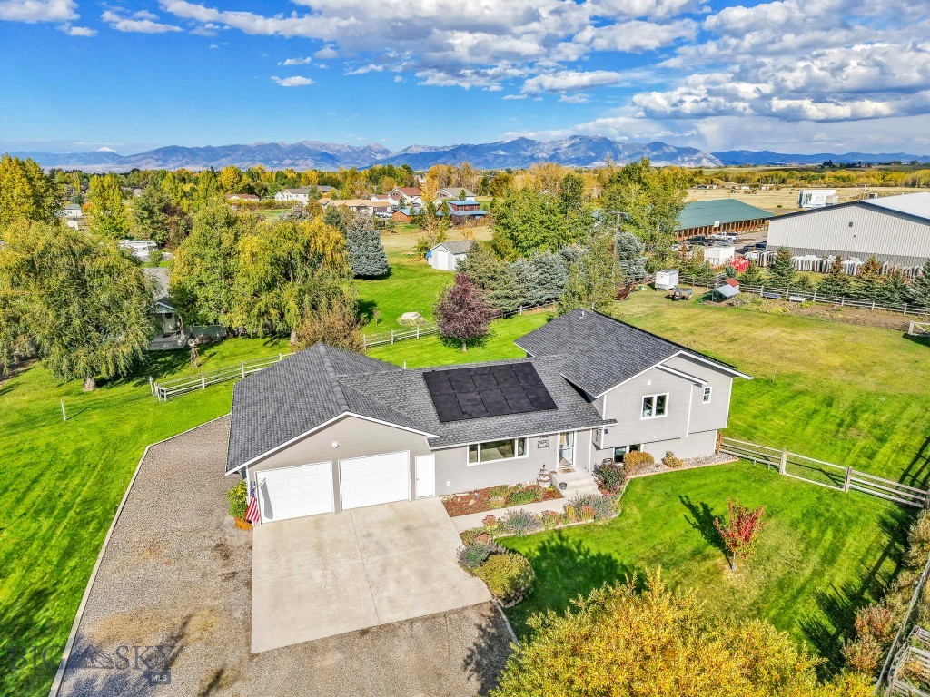 Well-Maintained Tri-Level Home with Mountain Views on Nearly an Acre
Enjoy the perfect blend of comfort, functionality, and location in this well-cared-for tri-level home, ideally situated on just under an acre with beautiful mountain views. Located within close proximity to Bozeman, Big Sky, and endless outdoor recreation—fishing, hiking, and skiing all just minutes away. The home features 4 bedrooms, 2.5 bathrooms, and a bright, open layout with vaulted ceilings and abundant natural light. A mix of hardwood and laminate flooring flows throughout the living areas, enhancing the warm, inviting atmosphere. The large laundry/utility room offers extra space for storage. Outdoors, mature landscaping, perennials, and partial fencing create a private setting. Recent updates include solar power and a new roof, adding energy efficiency and peace of mind. Whether you're seeking a year-round residence or a weekend retreat, this property offers the best of Montana living—space, views, and convenience.