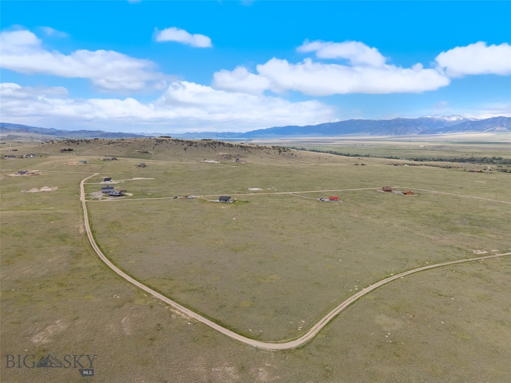 Located on a desirable corner lot at the intersection of Stage Coach Trail and Chipmunk Trail, this nearly 7-acre parcel in the scenic Shining Mountains Neighborhood offers a unique opportunity to create your Montana retreat with multiple access points and exceptional flexibility for home placement.
The property features numerous level building sites, allowing you to frame the panoramic mountain views from virtually any angle. Whether you're envisioning a rustic cabin or a modern ranch-style home, this lot provides the space and setting to bring your vision to life.
With fiber optic and power available in the area, you can enjoy modern connectivity without sacrificing the peace and beauty of the Montana landscape. With easy access from Hwy 287 and Varney Bridge, this parcel is just 20 minutes from Ennis and one hour from Bozeman Yellowstone International Airport. Outdoor recreation is close at hand, with nearby access to hiking trails, alpine lakes, the renowned Madison River, premium Blue Ribbon trout fishing, and prime hunting grounds.
Experience wide-open skies, sweeping vistas, and endless potential—this is Montana living at its best.