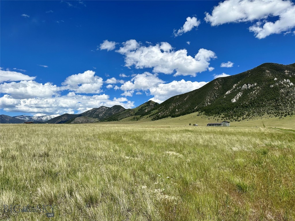 Minutes to (subdivision only) access to National Forest for your hunting, hiking, and horseback riding = recreational FUN! Build on this 20+ acre parcel that is tucked under the Madison Mountains and enjoy the views of both the Tobacco Root Mountains, the Gravelly Mountain Range, and miles of the Madison Valley views. Located just east of the Big Sky - Ennis public airport you can fly in and be at your home in minutes. You would be located about 20 minutes south of Ennis, MT or approximately an hour to Yellowstone National Park. Covenants help protect your investment on this south facing, gently sloping parcel of land. Power is all around, Fiber Optics is already to the parcel for your internet hook up, and area wells are ranging from 195' deep to 445' deep. In Montana you don't just buy a property - you purchase a new lifestyle. Come embrace a new one today and check out this parcel of land.....they aren't making any more of it!!
