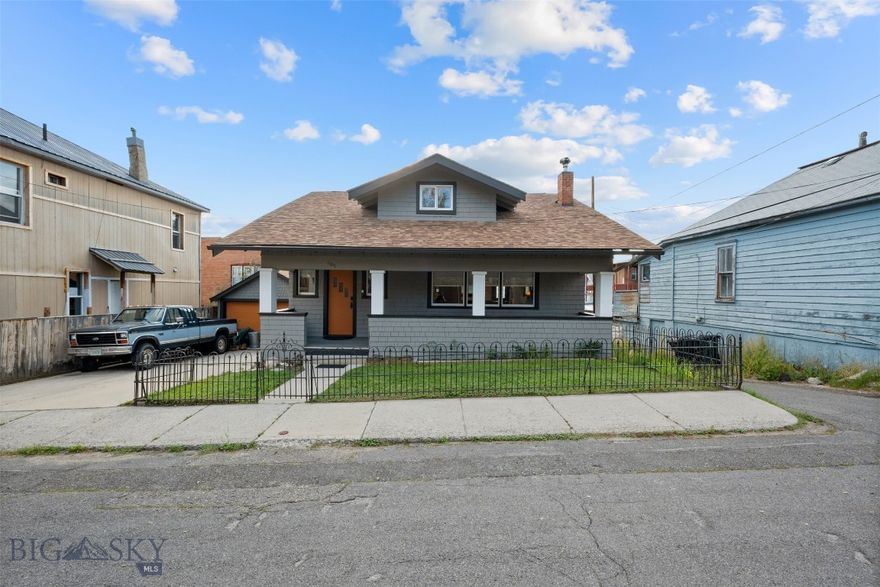 This 1918 Sears Craftsman combines an excellent location with preserved historic character and modern luxury upgrades. Situated near Montana Tech, St. James Hospital, and Uptown’s shops and dining, the home offers convenience with rare features and high-end updates.
This 3-bedroom, 2-bath home offers approximately 2,000 sq. ft. of living space and has been completely remodeled from top to bottom. Updates include modern plumbing and fixtures, a 200-amp electrical service, new attic insulation, interior and exterior paint, and beautiful real maple hardwood floors that flow throughout the main living areas. Comfort is further enhanced by a new furnace, smart thermostat, and a wood stove that add both warmth and character. Step inside to a bright open-concept floor plan enhanced with original coffered ceilings, exposed beams, brick accents, and built-ins that showcase the home’s Craftsman heritage. The chef’s kitchen is designed for both function and style, featuring granite counters, a rolling butcher block island, modern cabinetry, and updated appliances. The bathrooms are fully renovated: the main-level bath features a soaking tub with tiled surround and new fixtures, while the upstairs primary suite offers a true retreat with a walk-in closet, extended storage, dual sinks, dual shower heads, and a private sauna.
Extensive updates included BSB testing and remediation, ensuring the home is as safe as it is beautiful. Additional highlights include a rare detached 2-car garage with wood stove hookup ready for future heating, off-street parking, and inviting outdoor spaces with a covered front porch, wrought-iron fenced yard, and a back deck with western views. Laundry and extra storage are located in the basement.
Blending history, craftsmanship, and modern amenities, this move-in ready Uptown home is a one-of-a-kind opportunity in today’s market.  Reach out to schedule a showing today!