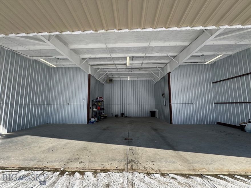 Rare opportunity to own a premium T-Hangar at the Bozeman Airport. This 2016-built, west-facing hangar benefits from excellent natural snowmelt—greatly reducing ice buildup and making winter access far easier than many other units on the field. The hangar features gas heating, radiant floor heat, and radiant heat along the exterior sidewalk for added convenience and comfort. With a door opening measuring approximately 41' 6" wide, 23' deep, and 12' high, this unit can accommodate a Vision Jet. Shared restrooms are conveniently located at the end of the building. Hangar must be used for aviation purposes. 


Listing agent holds a partial ownership interest in the property.
