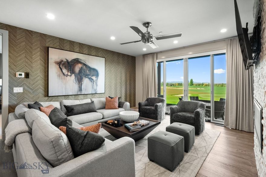 Experience the ultimate in Montana living with this custom-designed walkout Villa, perfectly positioned to capture sweeping views of the golf course, sparkling ponds, and the Tobacco Root Mountains. Inside, every detail has been thoughtfully curated with rich wall treatments, custom window coverings, and high-end finishes throughout. The open-concept living and kitchen area is designed for entertaining, with expansive windows that frame the remarkable scenery & a stone gas fireplace. Two luxurious primary suites each feature private spa-like en suite baths, with one suite opening onto a private patio for a serene retreat. An oversized main patio with built-in gas firepit provides the perfect setting for cozy outdoor gatherings while overlooking the fairways and sunsets. Additional highlights include a large pantry, bar with beverage fridge, beautifully designed powder room, custom closet finishes, upgraded lighting, and refined fixtures throughout. With a lock-and-leave design and unmatched surroundings, this Villa is the perfect blend of luxury and convenience. Just steps away, enjoy Black Bull’s exclusive amenities with an optional Social or Golf membership: a private restaurant, pool, fitness center, championship golf course, and cross-country ski trails. Please inquire for more club membership information. Furnishings, artwork, kitchen items and more are also available separately, please inquire for a true turnkey experience. Some photos are club amenities. Don't miss the Virtual Tour!