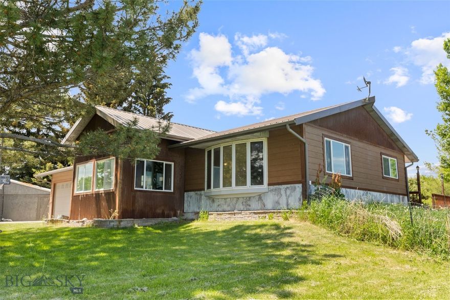 Prime Multi-Family & Commercial Opportunity with Unmatched Views and Versatility
Discover the potential of this 7.5-acre property just minutes from Bozeman, boasting exceptional visibility and high-traffic frontage—perfect for a wide range of investment opportunities.
The property features a spacious 5-bedroom home with sunlit living areas, a functional layout, and spectacular Bridger Mountain views. It’s ideal for multi-family living, employee housing, or generating rental income.
In addition, a 3,500 sq ft commercial-grade shop provides endless possibilities for retail, warehouse, light industrial, or service-based uses. With excellent signage along a well-traveled road, the location ensures built-in exposure and convenient access for customers and deliveries.
Added bonus: The property could potentially be subdivided into two lots, opening the door for future development, investment potential, or increased flexibility for long-term planning.
Whether you’re looking to expand your rental portfolio, combine business and residential space, or invest in a flexible-use property with unbeatable location and views, this one-of-a-kind offering delivers land, visibility, and lifestyle in one incredible Montana package.
Also listed as MLS# 403109, and 403106