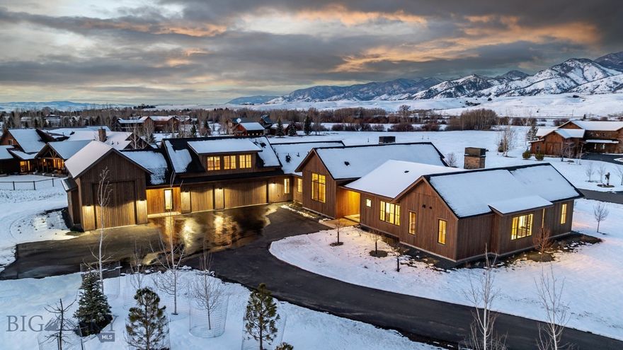 Situated in the highly coveted enclave of Manley Meadows, this estate offers a rare combination of secluded mountain tranquility and immediate access to the vibrant pulse of downtown Bozeman. The residence is a triumph of mountain modern architecture, defined by clean lines and an organic material palette that honors the Montana landscape. Clad in premium fir siding, the home is punctuated by Pella Architectural Grade windows, specifically engineered to frame the staggering 360-degree mountain views that define the property. The open-concept heart of the home is designed for the high-end entertainer. The expansive living room, featuring a sleek gas fireplace, flows effortlessly into a world-class culinary center. This chef’s kitchen is outfitted with a full suite of professional Wolf and Sub-Zero appliances. A comprehensive butler’s pantry provides a secondary prep space, complemented by a dedicated wine fridge and beverage drawers for flawless hospitality. Authentic pine ceilings soar overhead, adding a layer of warmth to the sophisticated, airy interior. Thoughtful design ensures that every inhabitant enjoys total privacy and comfort. Each bedroom in the estate is a full suite, boasting its own dedicated ensuite bathroom and a bespoke, built-in walk-in closet. The main-level master wing serves as a private sanctuary, offering direct access to the outdoors and a spa-inspired bathroom. Residents can indulge in a custom steam shower and the consistent warmth of radiant heated floors—a necessity for crisp Montana mornings. The lifestyle afforded by this estate extends to the upper level, where a theater room or workout room can be accessed without leaving home. Whether for game days or movie nights, this space is the ultimate retreat. For the outdoor enthusiast, the massive heated garage is a standout feature, meticulously designed with an RV bay and ample room for a workshop or gear storage, ensuring your adventures are always ready to launch. The experience culminates in the exterior living and dining areas. Strategically positioned to capture the glow of the sunset over the Bridgers, the outdoor spaces are designed for year-round enjoyment. From the covered dining patio to the expansive lounging decks, every corner of the property celebrates the unparalleled 360-degree vistas that make Manley Meadows Bozeman’s premier mountain destination. This is more than a home; it is a legacy estate crafted for the most discerning buyer.