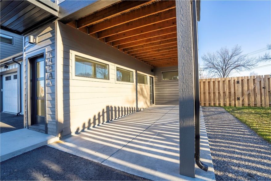 Welcome to the final phase of Rogers! This newly built condo is perfectly positioned to take in beautiful, lush views, blending modern design with everyday functionality. The main level features a flexible bedroom and a full bathroom just across the hall, ideal for guests or a home office. The kitchen is outfitted with stainless steel appliances, a gas range, and a stylish tile backsplash, opening seamlessly to the living and dining area. A covered back patio leads to a fully fenced, landscaped yard, perfect for enjoying Montana’s seasons. Upstairs, the spacious primary suite includes a walk-in tile shower, double vanity, and a generous walk-in closet. Two more bedrooms, a full bath, and a cozy nook at the end of the hallway offer added space for work or relaxation. Enjoy morning coffee or evening sunsets on the covered balcony with serene Bridger views. This is one of the last opportunities to purchase in Rogers’ final phase, don’t miss out on this thoughtfully crafted home.