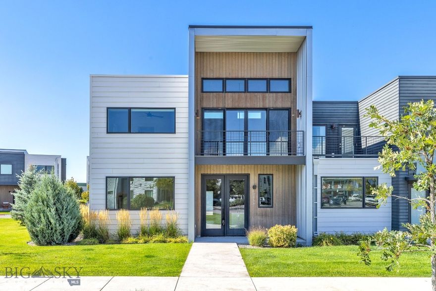 3866 Blondie St offers a space that truly adapts to every part of your lifestyle. The main level is designed for connection, with an open living, dining, and kitchen space. Custom built-ins and a striking fireplace surround create a focal point, while the kitchen features a gas range and updated black hardware that add both function and style. Upstairs, you’ll find three bedrooms and a flexible loft space, perfect as a home office, reading nook, or play area. The primary suite includes thoughtful upgrades such as improved ventilation, blackout shades, and an updated bath for added comfort. Renovated guest and powder baths, upgraded closets, custom built ins, cork doors and a convenient laundry sink make the entire home as practical as it is beautiful. Details like ceiling fans throughout, modern steel stair rails, and custom blinds elevate the everyday. Step outside to your private balcony and take in the Bridger mountain views, or enjoy the ease of lock-and-leave living with HOA dues that cover water, lawn care, and snow removal to your door. This property is also approved for solar- ready for future efficiency. Set in Northwest Bozeman, you’ll love being minutes from Chief Joseph Middle School, community parks, trails, restaurants, and shopping. This home is move-in ready, beautifully updated, and designed to complement the way you live.