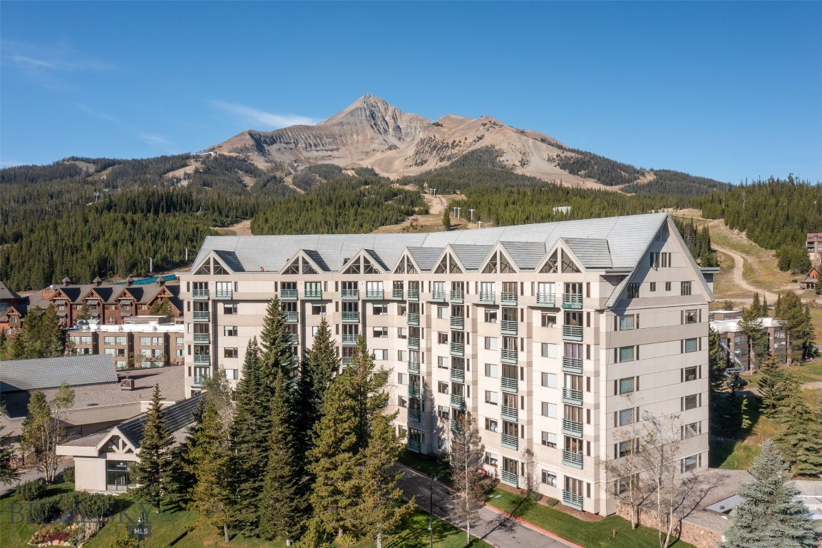 This 3rd-floor Shoshone condominium offers a premier Mountain Village location with breathtaking views of the surrounding Montana wilderness. Positioned in the heart of Big Sky Resort, this ski-in/ski-out property delivers unbeatable access to the slopes—just steps from the lifts and base area amenities.
Offered fully furnished and turn-key, this 1-bedroom, 2-bathroom unit comfortably sleeps six and is thoughtfully designed to maximize space and comfort. Enjoy a welcoming open-concept layout, well-equipped kitchen, and large windows that capture stunning vistas.
Shoshone owners and guests enjoy an impressive suite of resort-style amenities, including a heated indoor/outdoor pool, fitness center, sauna, concierge services, valet, maid service, dedicated parking, and more. Whether you're looking for a rental investment or a mountain getaway for year-round enjoyment, this property offers tremendous value in one of Big Sky’s most iconic locations.