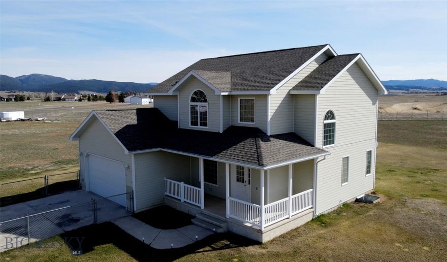 Nestled on 2.5+ acres in south Butte, this property offers the perfect balance of peaceful, semi-country living with the convenience of being just minutes to town.  Enjoy access with paved roads most of the way.  This spacious home features four bedrooms and two and a half bathrooms.  The main floor includes a welcoming living room, dining room, kitchen and a convenient half bath.  Upstairs, you will find four bedrooms, including a generous master suite, along with two full bathrooms.  The full basement is currently unfinished, offering a great opportunity to create additional living space to suit your needs. The fully perimeter-fenced 2.5-acre property provides ample space to accommodate your motorhome, extra vehicles, trailers, and all your favorite outdoor toys. Whether for storage or recreation, you'll have plenty of room to make the most of your land.  Additionally, the property is conveniently serviced by natural gas, ensuring reliable energy for your home. Newer roof. (Property is agent owned. Some pictures are virtually staged to help buyers see the potential of the space, these pictures are watermarked "Virtually Staged").