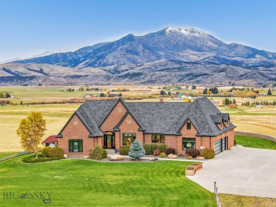 Welcome to 2375 Mount Ellis Lane, where modern mountain luxury meets Montana tranquility. Perched on 20 acres and backing directly to state land, this stunning 6,286-square-foot estate was originally built in 1995 and completely transformed between 2022–2023. Every inch has been thoughtfully redesigned with craftsmanship and comfort in mind. The home features 5 bedrooms, 5.5 bathrooms, and a bunk room, along with a chef’s kitchen fitted with all-new appliances and designer finishes. Expansive living spaces capture panoramic views through brand-new windows and open seamlessly to the outdoors. Wellness and recreation are built into the design from the state-of-the-art gym with awe-inspiring mountain views to the indoor basketball court, sauna, and SwimEx pool. After a workout, unwind in the outdoor hot tub and soak in the beauty of the surrounding landscape. Additional upgrades include a new roof, new windows, garage doors, real wood flooring, exterior doors, appliances, landscaping, asphalt driveway, and an EV charging station. Offering unmatched privacy, luxury, and connection to nature all within minutes of downtown Bozeman this home truly embodies the best of Montana living.