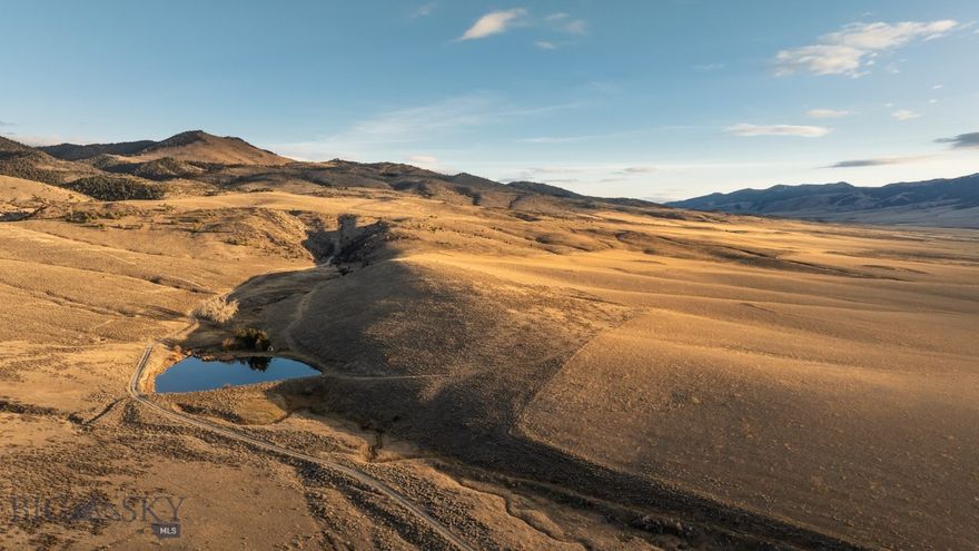 The perfect Montana escape, in the foothills of the Ruby Range sits Ruby Foothills Ranch, 443 +/-  sprawling acres of rolling rangeland, just five miles southeast of Dillon, a small western town with a population of 4,024. With improved grasses, reservoirs, pipeline fed water tanks and corrals, this ranch is ready for a new owner to make their mark. Previously used for rotational grazing, the ground is well suited to raise cattle and horses alike. Ruby Mountain Ranch is positioned between vast agricultural pivots and the high county of the Ruby mountains making the ranch a constant corridor for native wildlife such as mule deer, whitetail, elk and antelope. With picturesque views of the Ruby and Blacktail Mountains, outdoor enthusiasts are sure to find rest and recharge here with access to local amenities such as grocery stores, eateries, a hospital, Rocky Mountain Supply and Murdoch’s, all just 10 minutes away via year round accessible county roads. Word-class fly-fishing opportunities prevail on the Beaverhead or nearby Jefferson River and Maverick Mountain ski hill is a quick 45-minute drive from Dillon. A unique opportunity, don’t miss out on calling this scenic place home.