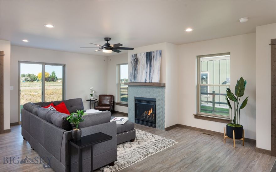 This brand-new home in The Meadows blends high-end finishes with smart design and sits just steps from future parks, trails, and the heart of Four Corners, just outside of Bozeman City Limits. Crafted by All About Homes & Land, this home features an open main floor designed for connection—whether you’re gathering around the kitchen island or relaxing by the fireplace. The kitchen includes granite countertops, soft-close cabinetry, and plenty of prep space. Large windows frame open-space views and bring in natural light throughout the day.
Upstairs, three generously sized bedrooms offer peaceful retreats, including a primary suite with dual vanities and a walk-in shower. A spacious landing provides added flexibility for a home office, reading nook, or play area. The backyard opens to community open space with direct access to the future four-acre park, complete with playgrounds, sports courts, and walking trails. A covered patio offers the ideal spot to enjoy Montana sunsets. Located in the growing Four Corners area with easy access to Bozeman, Belgrade, and Big Sky, this home offers both convenience and future upside. A new retail district with grocery and dining is on the way—making this location even more desirable. Ready for immediate occupancy.