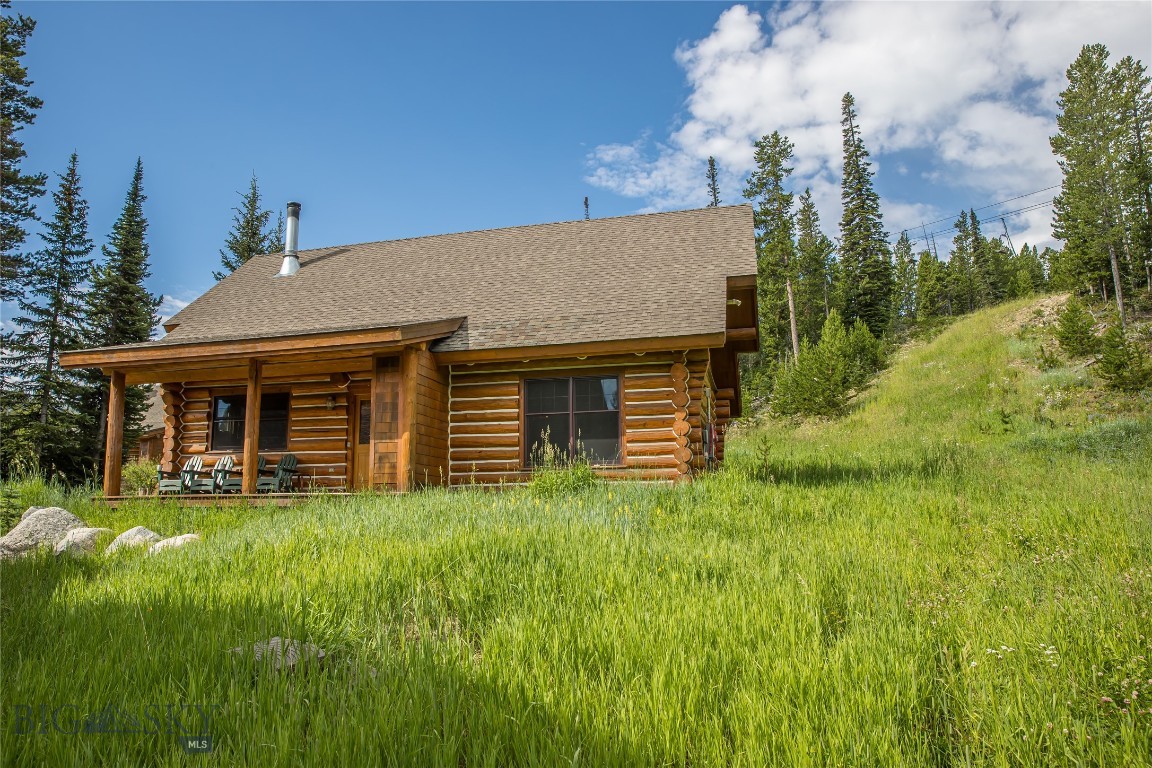 The "Idyllic" Montana ski cabin in the trees!
Ski in-Ski out to this beautiful cabin nestled in the trees with the White Otter lift literally right out the back door.
The owners have taken pride in this unit with a number of upgrades, including a new roof!
Warmly decorated with 2 guest bedrooms on the main floor, relaxing living area with wood burning fireplace, kitchen and dining area. Upstairs features a sitting area, master bedroom and bath!
After a day on the slopes, relax in the new hot tub.
Sold furnished.
Located only minutes from the base area yet privacy is paramount!
This unit rents very well affording the buyer a steady cash stream.