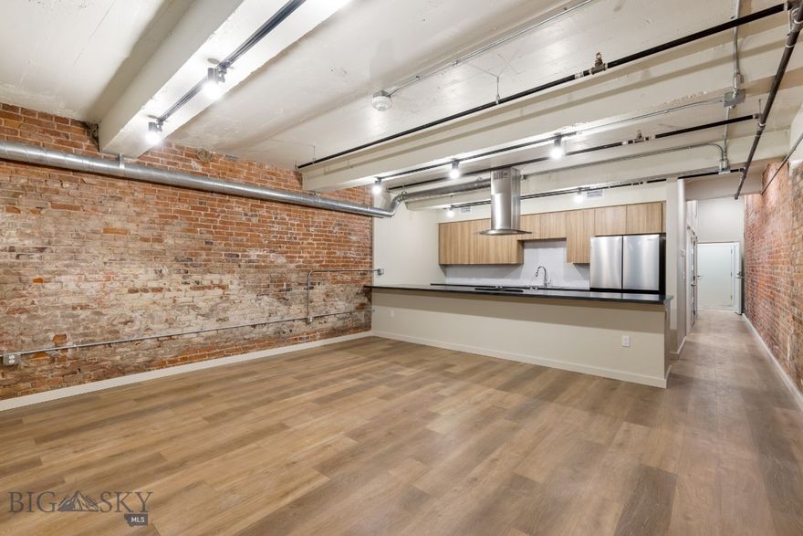 Experience modern living in historic Uptown Butte at Rudolph Condos, Butte's newest condominium development. This 1-bedroom, 1-bathroom condo features an open floor plan and exposed brick. The stylish kitchen boasts stainless steel appliances, while the spacious living area is perfect for entertaining. Located in the heart of Uptown Butte, you’ll enjoy easy access to dining, shopping, and local attractions. Don’t miss this rare opportunity to own a contemporary condo in a vibrant, historic setting!