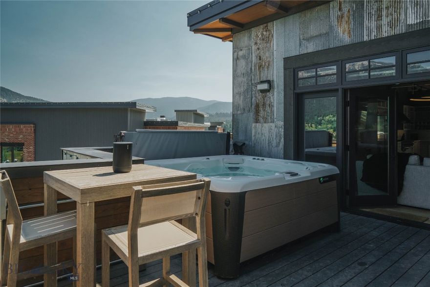 On top of it ALL -- what a very special opportunity to own a one-of-a-kind extremely hip mountain contemporary designed penthouse with just a hint of a city loft vibe, this 4 bedroom, 3  and a half bathroom residence is elevated above just about everything Town Center. Offering front and center views of Lone Peak, Spanish Peaks as well as views down valley this is ready and waiting for you and your loved ones to call home in Big Sky. Bring that party outside on your very own private wrap around deck, take in all the activities and events the Big Sky Town Center has to offer all while enjoying coveted privacy. Take in the sounds of the Big Sky Art's Council's Music in the Mountains without ever having to worry about crowds, not to mention other well-known and well-loved Big Sky events such as PBR, summer farmer's market, special holiday events, Blue Buddah Sushi Restaurant just an elevator ride away and much much more. When location and address is everything 99 Town Center Avenue is undoubtedly it! This unit also comes with its own storage unit on the lower floor.