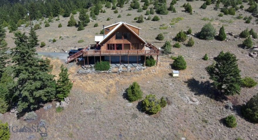 Rustic Mountain Retreat with Breathtaking Views & Endless Adventure:  Nestled in the heart of the mountains, this charming rustic home offers the perfect blend of tranquility and year-round comfort.  Featuring 2 bedrooms and 2 bathrooms, the open-concept layout boasts vaulted ceilings, a wraparound porch, and stunning views of the valley and the Tobacco Root Mountains. 
Enjoy the sounds of nature from your balcony or relax by the small creek that runs through the property.  The spacious primary suite includes and ensuite bath and private balcony-perfect for morning coffee with a view.  
Additional features include a single-car garage with extra storage, and plenty of room to build your dream shop, guest cabin, or garden.  With no HOA's or covenants, you're free to enjoy this property on your own terms.  
Bordered on two sides by BLM and State land, this is true outdoor enthusiast's paradise-ideal for hunting, hiking, biking, ATV adventures, fishing, floating and horseback riding right out your back door.  
Whether you're seeking a full-time residence or a peaceful getaway, this mountain gem offers unmatched freedom, beauty, and opportunity