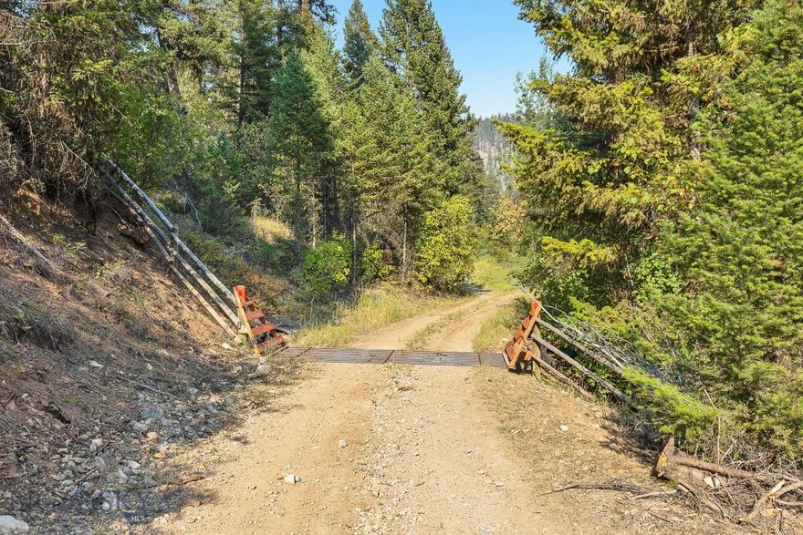 Very rare legacy property not too far from Missoula. 100+ usable Acres. 
2 Sides border public (State) lands. 
Year around access through locked gate. 
Partially fenced with wildlife friendly fencing. 
Tons of water, Camas Creek is year-around. 
Private year-around spring near the building site. 
No zoning, No HOA, No covenants. 
Located over 2 miles behind a locked gate, very private parcel. Multiple additional building sites. 2-1/2 sides border Montana State lands. 
Cell coverage on the property. 
Main road is annually maintained by the County. 
Some of the best hunting in the Missoula area. MT Hunting District #292 

Pre-qualified buyers only.
