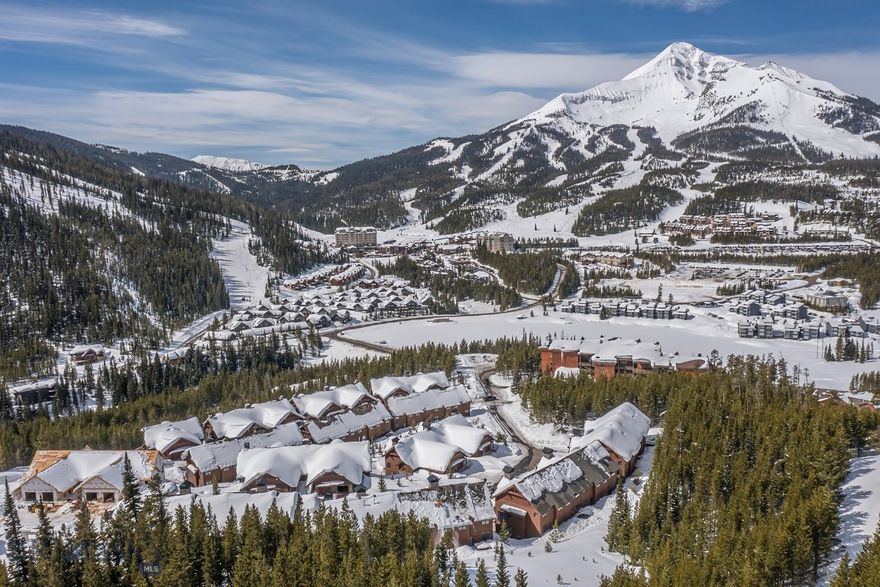 Welcome to a 3 bedroom refined mountain retreat where modern comfort meets timeless style. Ideally positioned in the highly sought-after back row, this residence sits at a naturally higher vantage point—offering even more dramatic, unobstructed views of Lone Peak right from your living room and deck.  The gourmet kitchen is designed for both beauty and function, showcasing high-end appliances, elegant finishes, and ample workspace for effortless cooking and entertaining.  Step out onto the expanded deck—larger than those found in earlier phases—to enjoy morning coffee, evening sunsets, or simply soak in the unmatched alpine scenery.  Don’t miss the chance to experience Big Sky living at its finest—your elevated alpine escape awaits.   Interior of condo under construction.