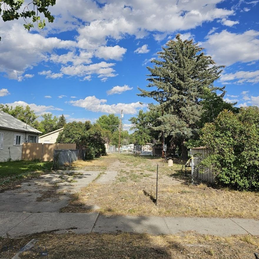 Fantastic city lot in the charming town of Three Forks, MT.  Located near schools, Main Street, the golf course, the river, and the rodeo grounds, this property offers both convenience and small-town charm. Manufactured homes are permitted—a rare opportunity in the area—and there’s even a rear-entry garage option from the alley.

Whether you’re a first-time homebuyer or an investor, this is an affordable and versatile opportunity. With land becoming scarce within city limits and surrounding areas, it also presents a smart long-term investment.

Enjoy being within walking distance to fine dining and the historic Sacajawea Hotel. The property includes both city water service and a sandpoint well for added value and a shed. 

If moving a manufactured home to the lot the City of Three Forks requires that the home be 10 years or newer.