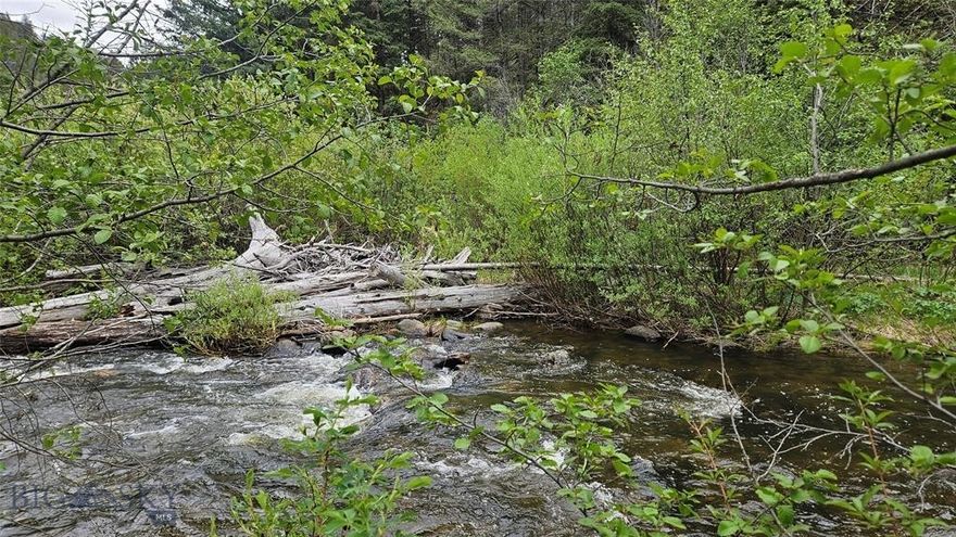 11+/- acre Montana property with a CREEK, BORDERING NATIONAL FOREST, and YEAR-ROUND access! This beautifully wooded property has everything you’ve been looking for- Privacy, Views, Wildlife Galore, Creek frontage, a site that you can start camping on today, and bordering the National Forrest. Basin Creek flows right through this spectacular property; Basin Creek is a large creek with great fishing. You can follow Basin Creek upstream and enjoy its magnificent large granite boulders and small cascading waterfalls as you wind your way farther into the National Forrest. There are thousands of acres of National Forest here for you to explore. Realistically, there is so much National Forest that you’ll have a hard time exploring all of it in one lifetime! You’ll enjoy fresh mountain air, lush Pine trees, and the relaxing sound of cool, rushing water. Moose, Elk, Deer, and Black Bear roam this property and are common neighbors. This perfectly located recreational property is only about 30 minutes from Helena or Butte, where you can find all the supplies you could ever need, shopping, dining, art galleries, fairs, and many employment opportunities. When you have been dreaming of finding the perfect Montana Property, this is it! You won’t find many opportunities to buy a piece of land like this one. Year-round access, with a creek and bordering National Forest, this is a rare opportunity to own your dream property.