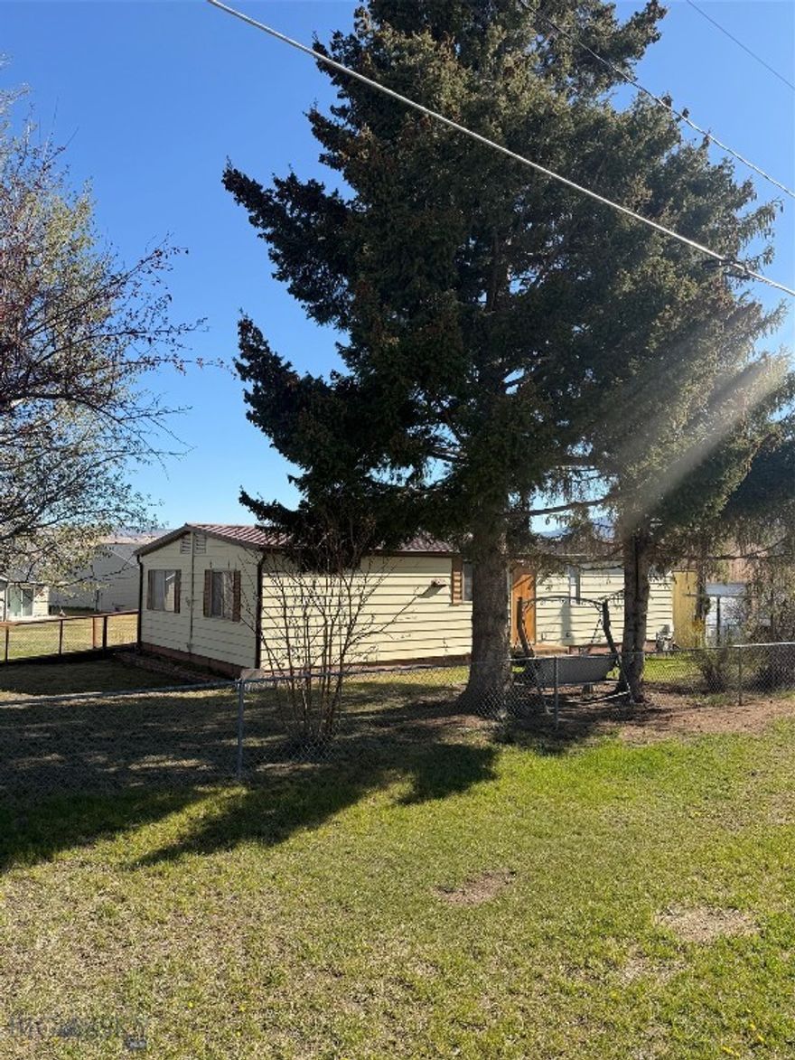 Well-maintained 2 bed, 2 bath manufactured home offering a fenced yard and double detached garage, set on a spacious corner lot. Enjoy the perfect covered patio—ideal for relaxing or entertaining. Great opportunity for a starter home or investment property.