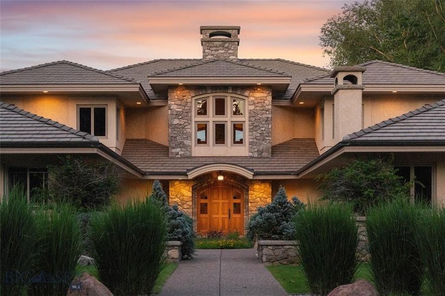 Welcome to 7,000+ sq ft of refined living on 1.8 private acres on the Missouri River — just steps from the prestigious Meadowlark Country Club. This extraordinary 5-bed, 6-bath estate blends luxury, privacy, and lifestyle. Enter through a gated drive into a serene, manicured setting where craftsmanship shines. Inside, rich custom woodwork, chef-grade Viking appliances, and a custom wine cellar set the tone for elegance. Expansive living areas, a cozy sunroom, and soaring ceilings feel both grand and inviting. At the heart of the great room, a dramatic floor-to-ceiling rock fireplace adds warmth, character and a striking focal point. Entertainment features include a sports room with full bar, plus a luxurious indoor pool and hot tub for year-round enjoyment. Outdoors, enjoy river access, a private dock, and landscaped grounds perfect for relaxing or hosting by the water. All this, in a quiet neighborhood just steps from the golf course — a private retreat designed for living well.
